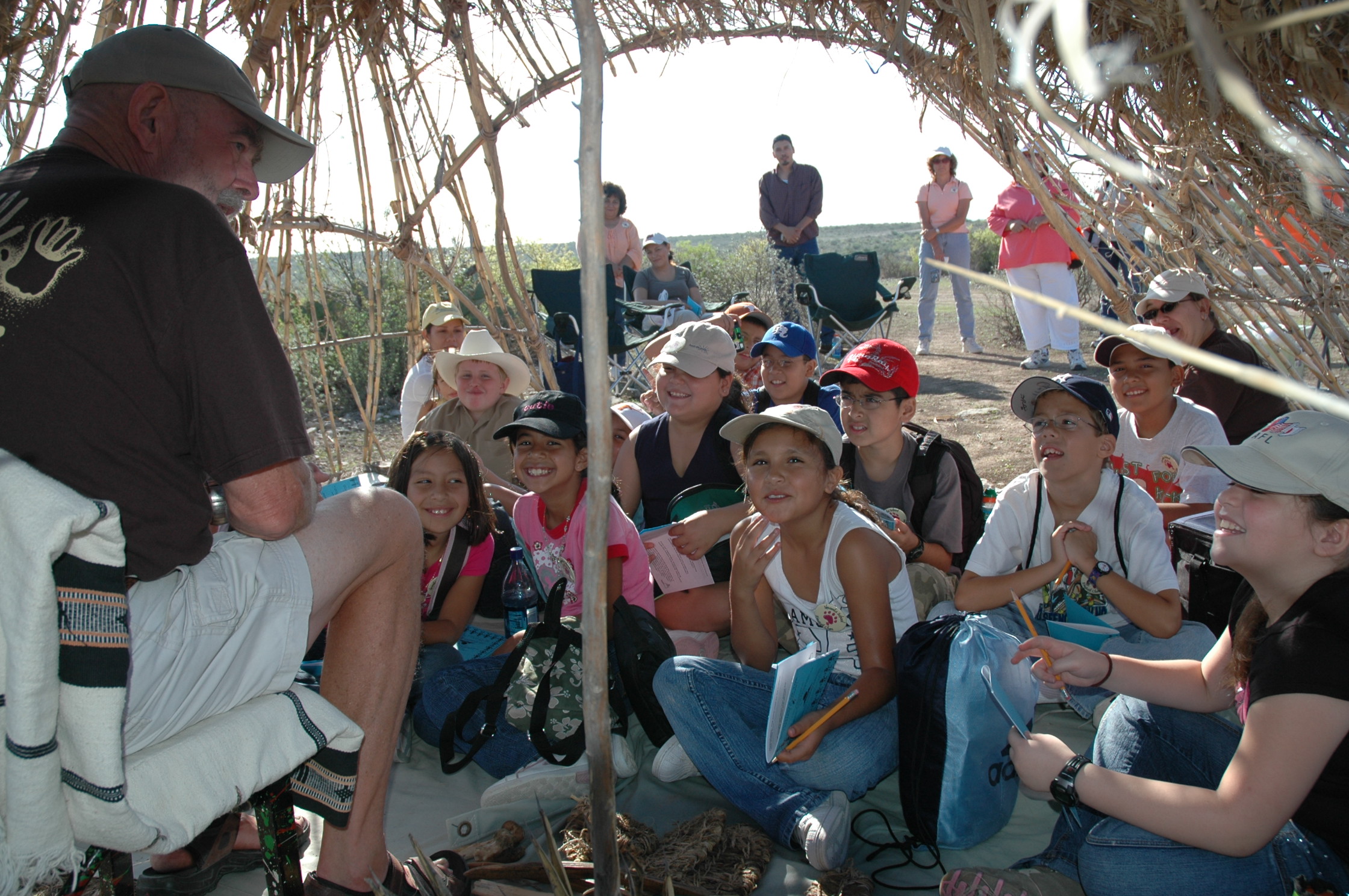 Children learning about prehistoric lifeways during a 2006 kids program.