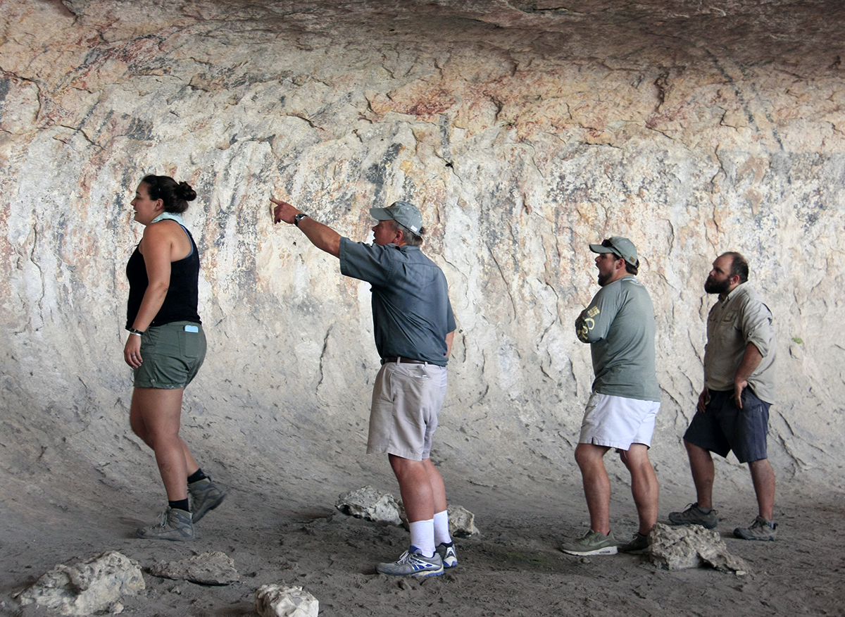 Stan and Ross discuss the pictographs with Amanda and Jerod.