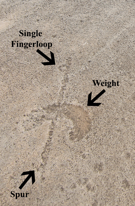 This floating atlatl at Lewis Canyon has an elongated atlatl weight rather than a circular weight.