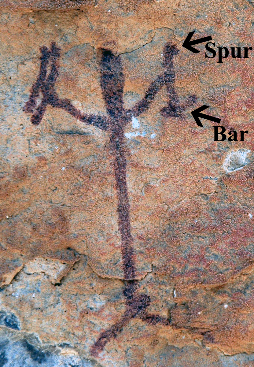Red Linear anthropomorph from VV1000. The black arrows point out the attributes of the atlatl.