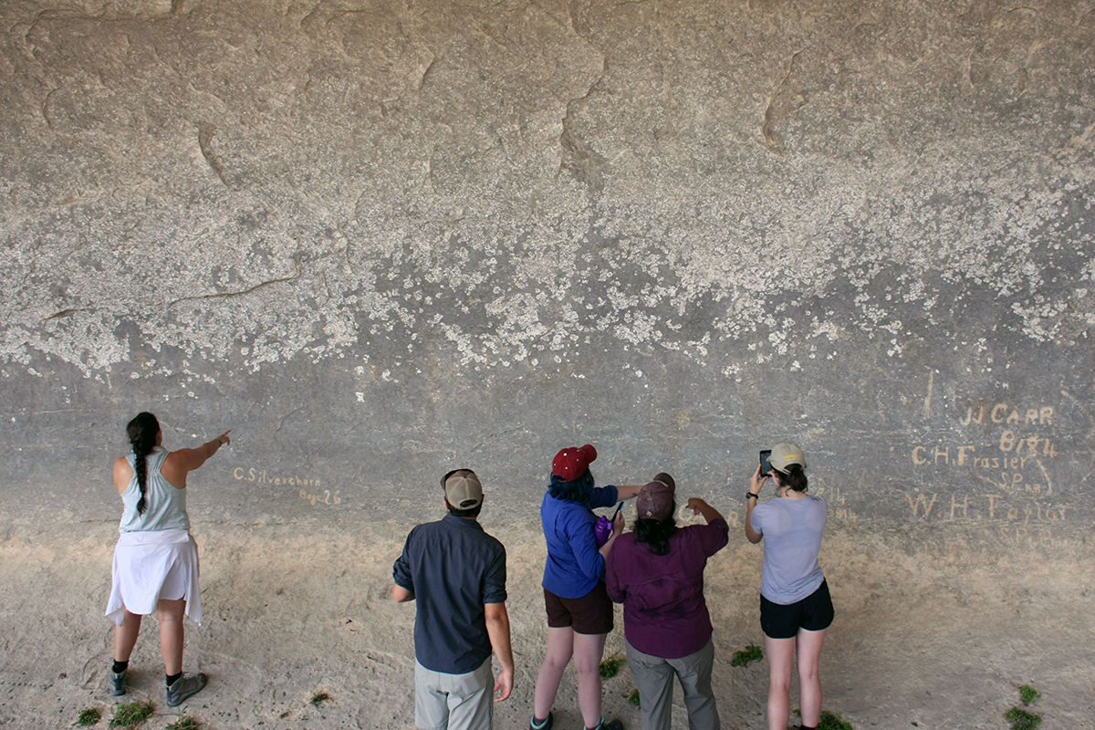 The Shumla research team pondering the poorly-preserved pictographs at Seminole Watering Hole.